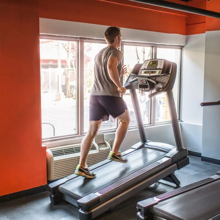 Person walking on treadmill during 12-3-30 workout